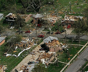 Homes damaged by severe thunderstorms are viewed from the air over Gladstone, Mo., Friday, May 2, 2008.